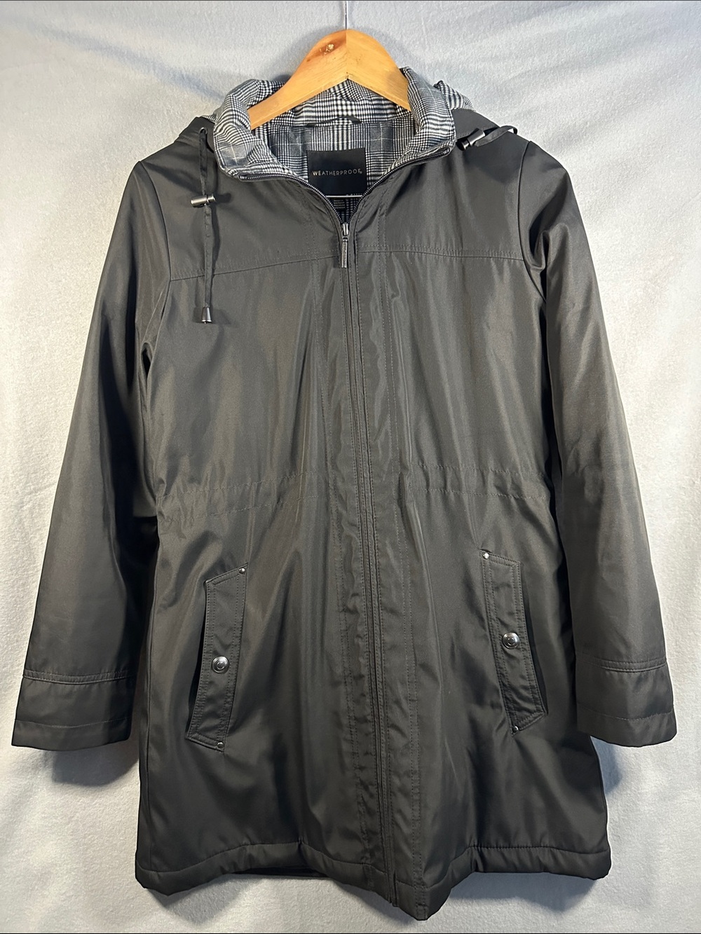 Weatherproof Black Hooded women’s Raincoat with Plaid Lining